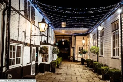 The-courtyard-at-night-The-Talbot-Inn-bespoke-hotels-Ripley-near-Wisley-Places-to-stay-in-Surrey-Visit-England-V5.webp
